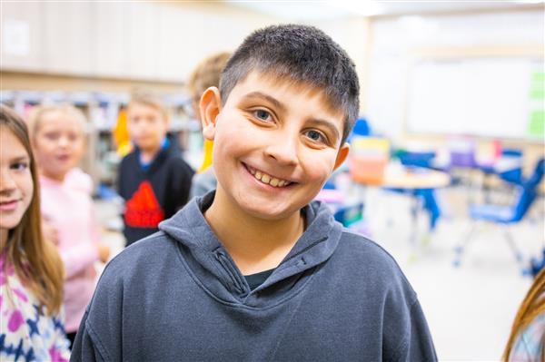 Students inside their classrooms learning. 